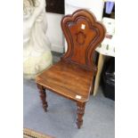 A Victorian mahogany hall chair.