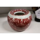 A small Chinese red glazed brush washer.