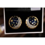 A cased pair of Swarovski decorative earrings.