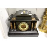 A Victorian black slate mantle clock.