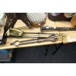 A good set of three brass and wrought iron fireside tools.