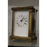 A brass carriage clock.