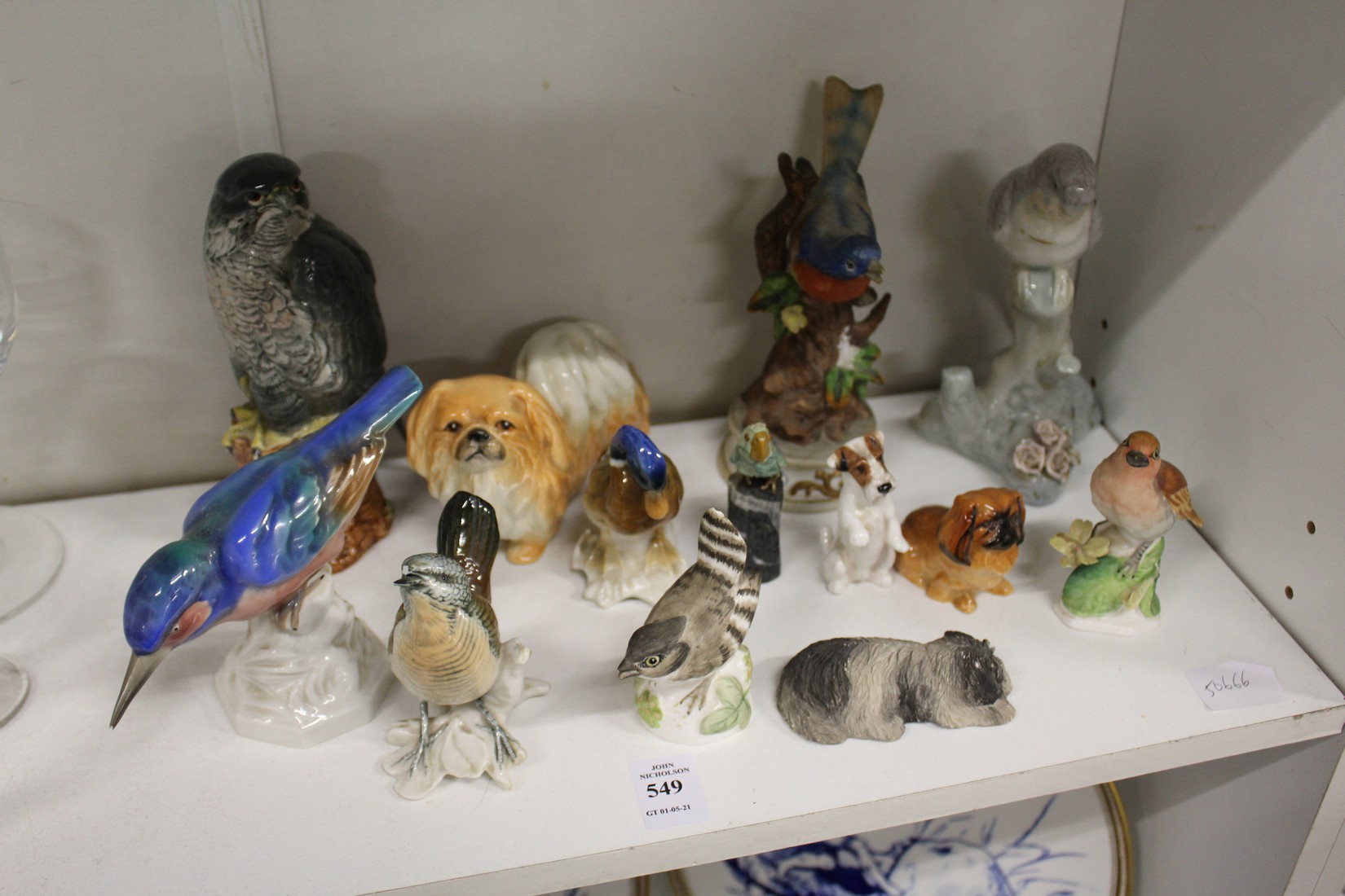 A group of collectable bird and animal ornaments.