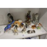 A group of collectable bird and animal ornaments.