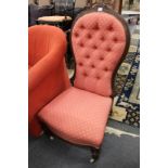 A Victorian walnut framed and button upholstered bedroom chair.