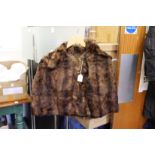 A ladies' small fur jacket.