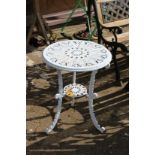 A small white painted aluminium patio table.