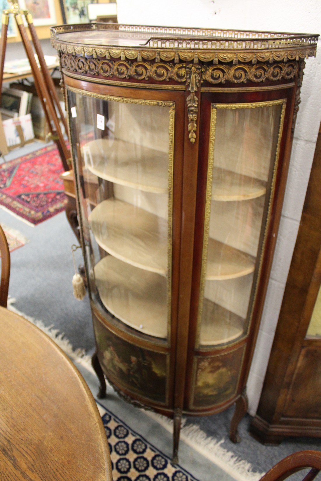 A Vernis Martin style French demi-lune standing display cabinet.