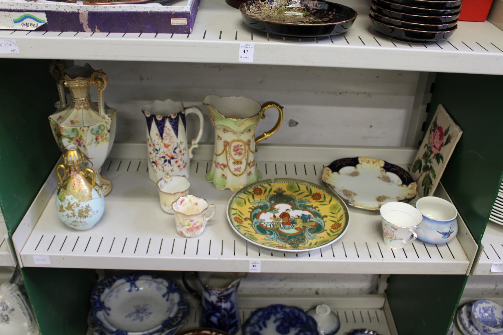 A shelf of decorative china.