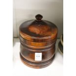A lignum vitae tobacco jar and cover.