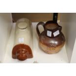 A Doulton salt glazed Harvest jug and a stoneware hot water bottle.