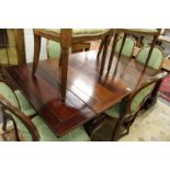 An Edwardian mahogany draw leaf dining table on cabriole legs.