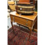 A mahogany two drawer side table.