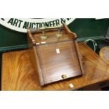 An Edwardian mahogany and brass coal box.