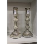 A pair of lustre glass candlesticks.