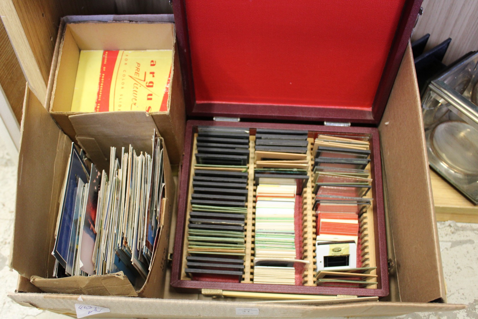 Various slides and postcards, together with a slide viewer.