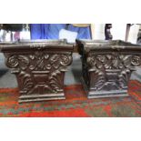 A good pair of painted cast iron jardinieres modelled as Corinthian column capitals.