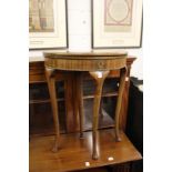 A small Georgian style mahogany demi-lune foldover table.