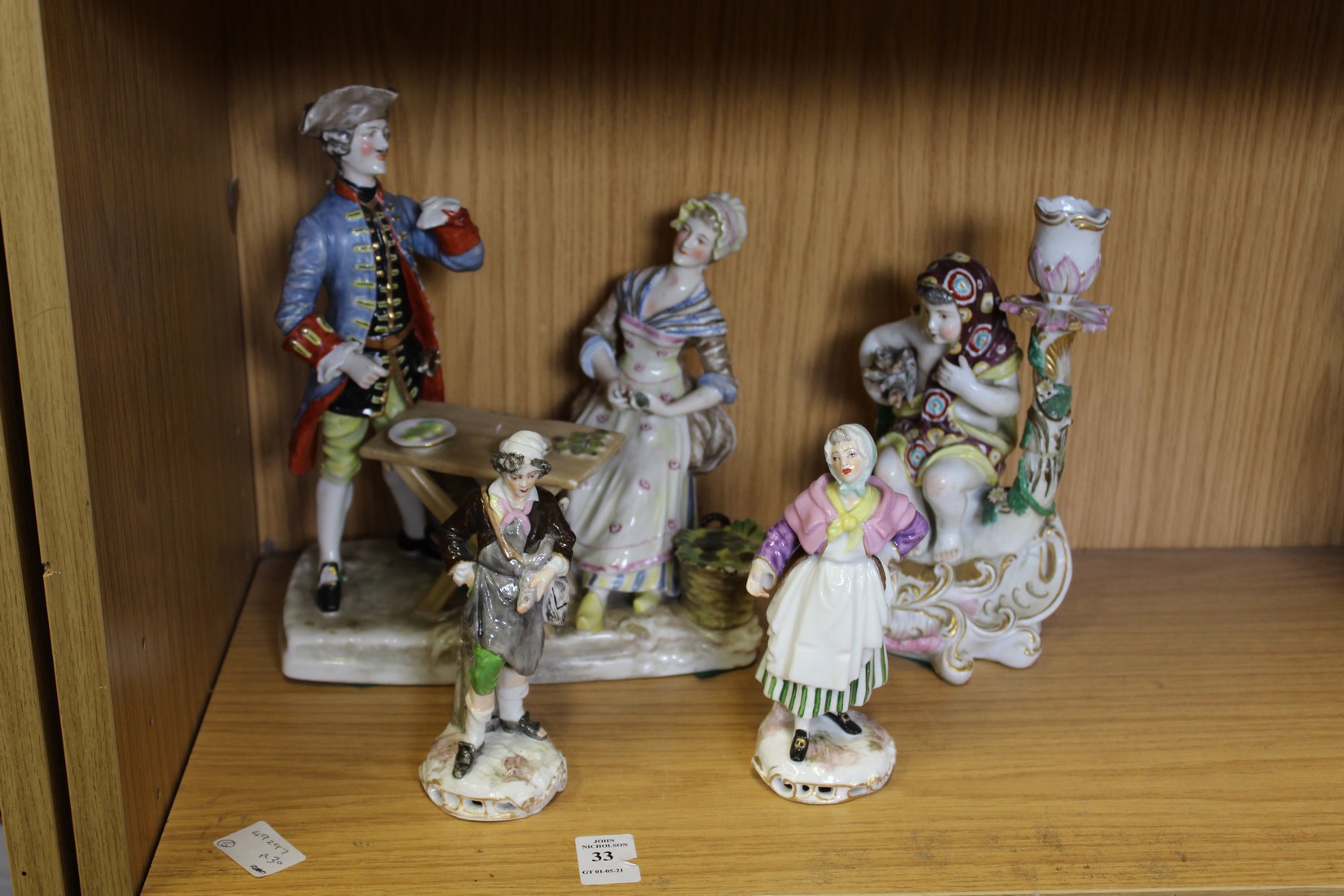 Decorative porcelain figure groups.