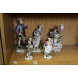 Decorative porcelain figure groups.