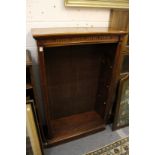 A Victorian walnut open bookcase.