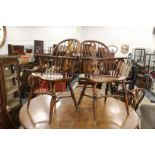 A set of eight Windsor style splat back ash and elm dining chairs, two with arms.