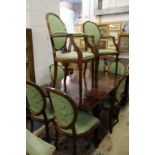 A set of eight mahogany framed shield back dining chairs, two with arms.