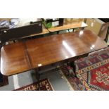 A reproduction mahogany sofa table.