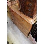 A pine chest of drawers.