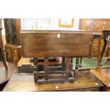 A small oak drop leaf gate leg table.