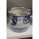 A small Chinese blue and white brush pot.