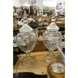 A good large pair of glass urns and covers.