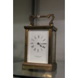 A brass carriage clock.