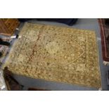 A Persian rug, beige ground with floral decoration.