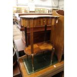 A French kingwood and rosewood two tier occasional table, with a single drawer.