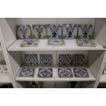 A good collection of sixteen Delft blue and white tiles, probably 18th / 19th century, mostly