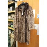 A ladies fur coat.