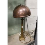 An Art Deco bronze lamp with copper shade.