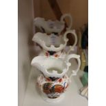 A graduated set of three Imari decorated jugs from the Murray Collection.