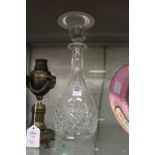 A cut glass decanter.