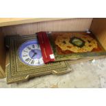 An Islamic leather blotter and a similar wall clock.
