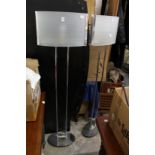 A pair of modern floor standing lamps.