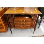 A mahogany music cabinet.