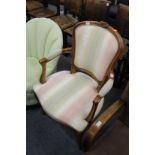 A French style beech framed open armchair.