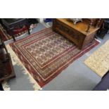 A Persian Bokhara rug.