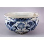 A CHINESE BLUE & WHITE PORCELAIN DRAGON TRIPOD POT / PLANTER, the body with a crackle glaze and