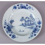 AN 18TH CENTURY CHINESE YONGZHENG PERIOD BLUE AND WHITE PLATE, painted with a landscape, native