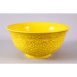 A CHINESE YELLOW GLAZED MOULDED LOTUS PORCELAIN BOWL - the body with moulded lotus decoration and