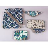 A GROUP OF FIVE 16TH/17TH CENTURY IZNIK AND DAMASCUS TILE FRAGMENTS.