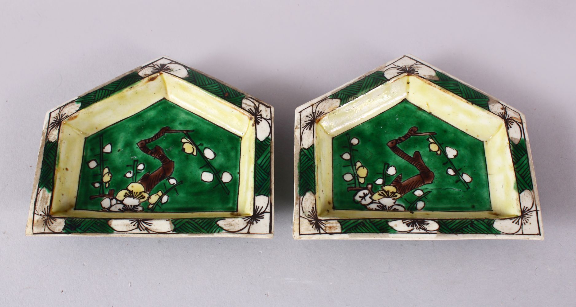 A PAIR OF CHINESE FAMILLE VERTE PORCELAIN FLORAL DISHES, depicting native views 10.5cm wide.